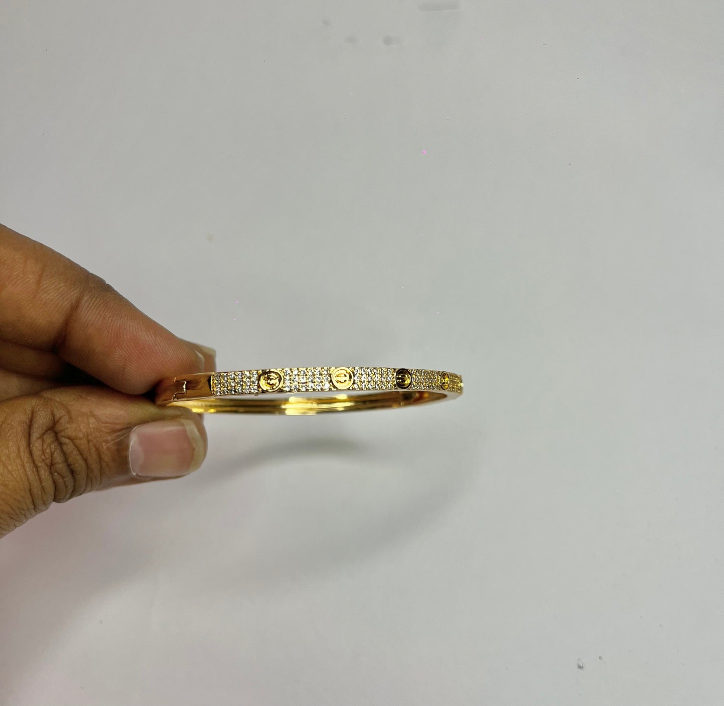 π Elegant Gold Textured Stone-Studded Bracelet